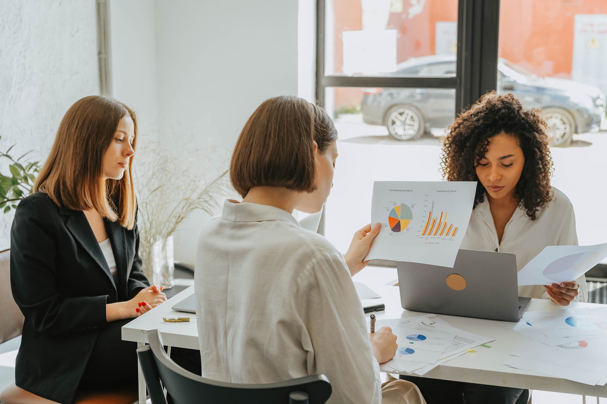 Three women working at a table